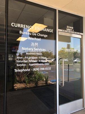 Entrance in the plaza with Farmers & Merchant Bank