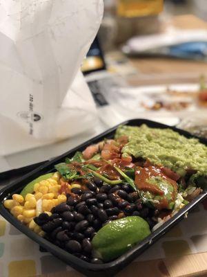 custom burrito bowl - guacamole, spinach, pico de gallo, black beans, corn, lettuce, and rice