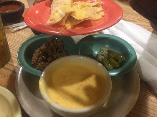 CHILE con QUESO.  SKIP IT!  My niece loves it, but this is gross.  Tastes like potted meat and cheese