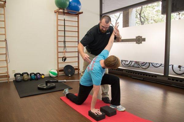 Modern Chiropractic care is more than just adjustments! This patient uses a key exercise to improve back mobility.