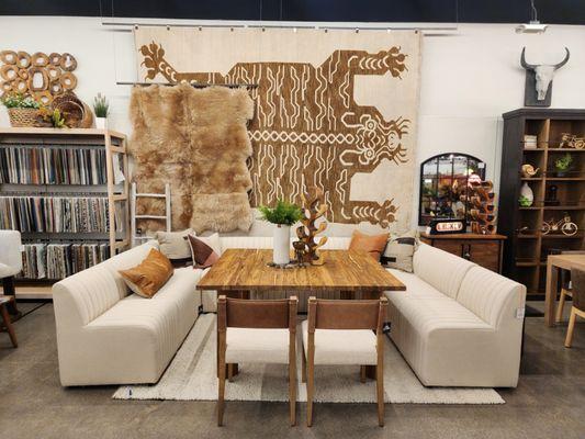 A dining banquette styled with large scale tiger art.