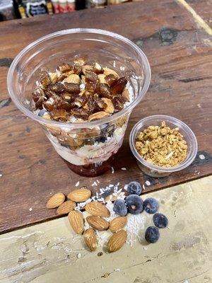 Mixed berries, vanilla Greek yogurt, blueberries, raw almonds, dates and almond toffee granola.