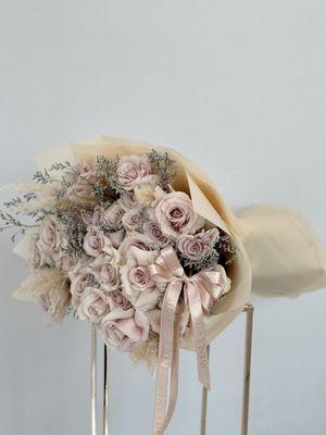 Introducing the "Elegance Bouquet" featuring a mesmerizing array of soft beige roses