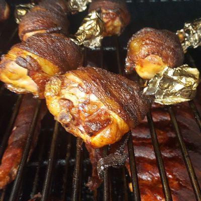 Smoked bacon wrapped chicken drumsticks