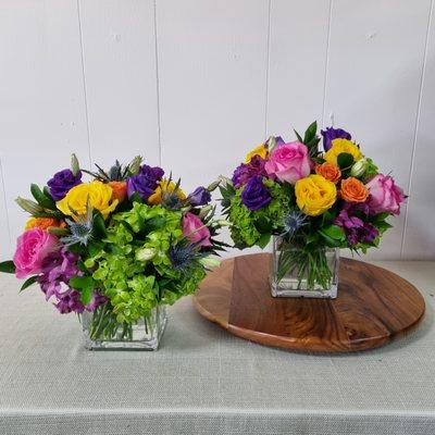 Colorful Centerpieces with hydrangea, alstroemeria, roses, spray roses, lisianthus and thistle.