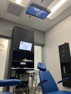 The clever tv that they had mounted on the ceiling playing cartoons for the children to look at while in their chairs. Such a cool idea!