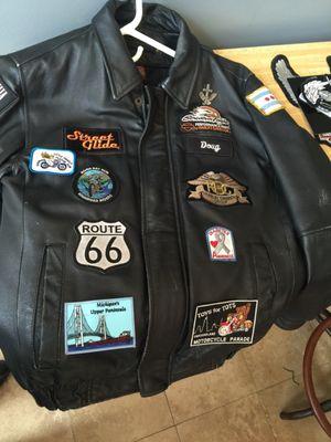 Front patches sewn on front of leather jacket