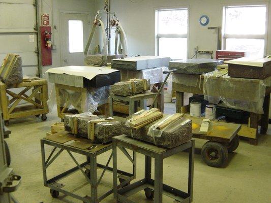 Granite headstones in our personal shop, getting set up for us to engrave.