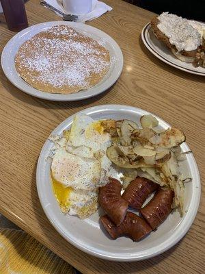 Elgin Sausage breakfast, pancake and country fried steak. The home style potatoes are the best!