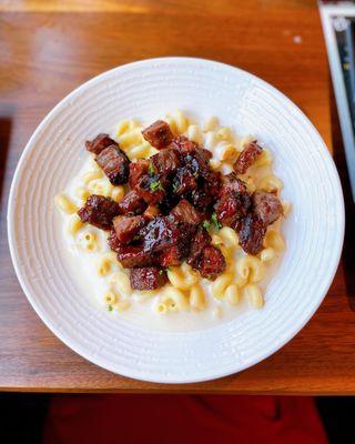 Brisket Burnt Ends Mac & Cheese: white cheddar Mac & cheese, brisket burnt ends, peach bbq drizzle