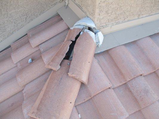 Cracked barrel tile at a ridge.