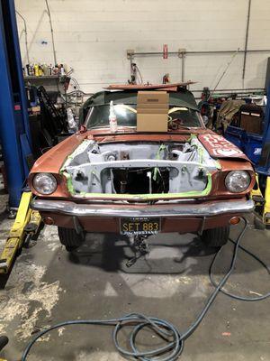 66 Mustang engine bay primed and ready for a fresh coat