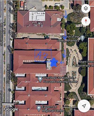 From LA fitness lot. Aerial view map. Park, follow arrows. Make a right and enter building for Pearson.