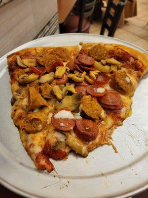 1 slice with pepperoni,  mushroom,  hot sausage...