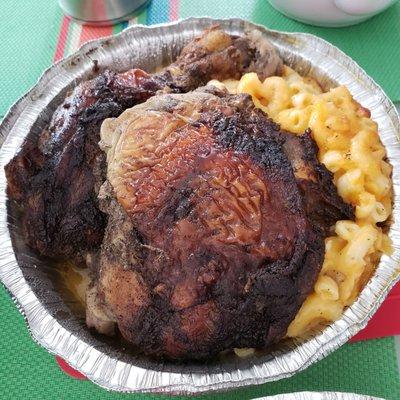 Jerk chicken with mac & cheese - Pretty big pieces of chicken. Not spicy or salty. $10 with two sides