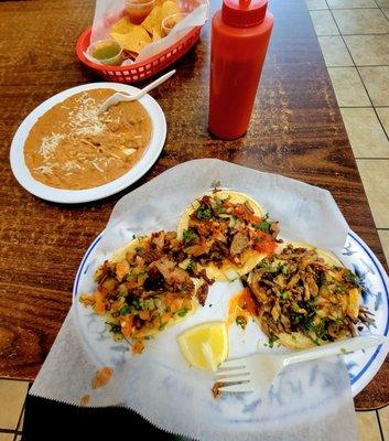 3 tacos refried beans and chips and salsa