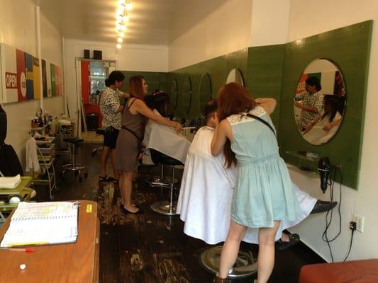 Hairstylists at work! Small space, great work.