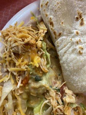 Plate Supreme- Chicken, guacamole, lettuce, sour cream, cheese, beans, rice and Mexican salsa. Served with a tortilla.