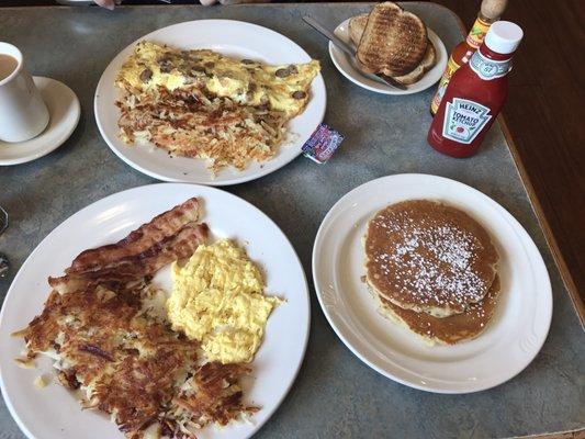 Scrambled eggs breakfast and a flattened sausage omelet