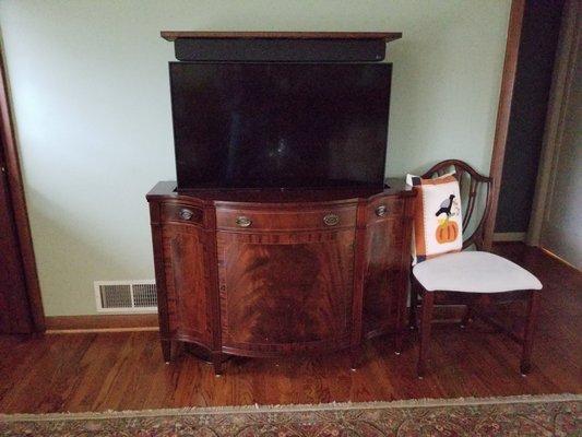 Converted this old cabinet into a lift TV cabinet. Stripping done by Timby.