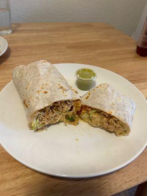 Chicken burrito and green salsa.