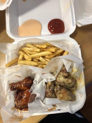 Bbq wings, garlic parmesan wings, fries, ketchup, and "yum yum" sauce