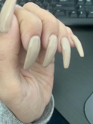 Sloppy around cuticle area. And lumpy nails.