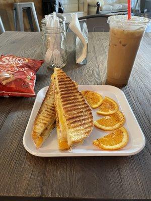 Chicken Panini. Comes with chips.  Iced Vanilla latte with almond milk