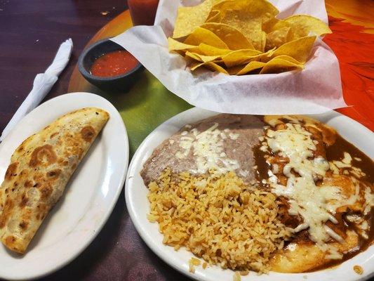 Beef quesidilla, enchilada, beans and rice plate