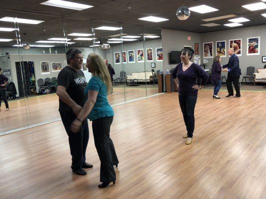 Students dancing and laughing on their private lessons.