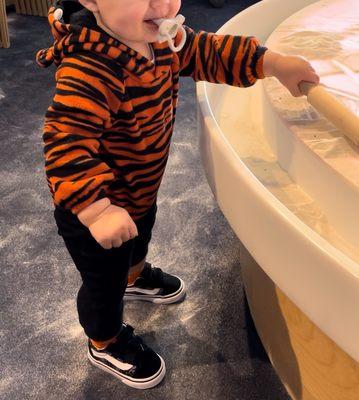 Playing with the sand in the 2nd floor "nursery"