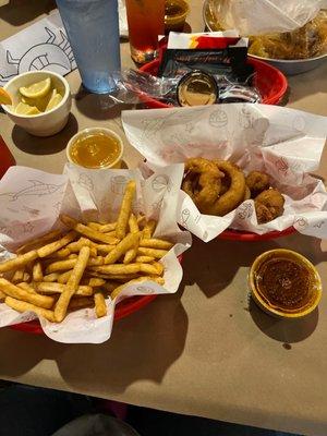 Cajun fries, onion rings and hush puppies.