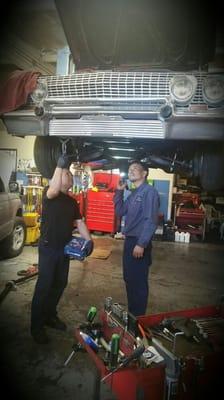 Working on a 1963 Chevy Impala...we go from classic beauties to modern machines! Team work is our best quality!  Lalo and Jose