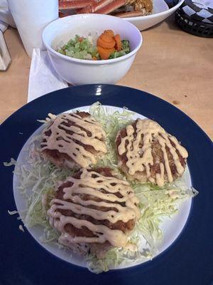 Crab cakes $24 and side of veggies $2