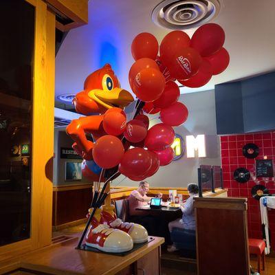 A Statue of the Character Red Robin inside the restaurant.