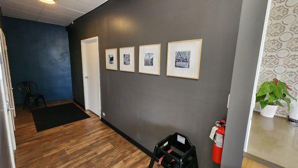 Very clean.  Hallway to the bathroom and beautiful pictures.