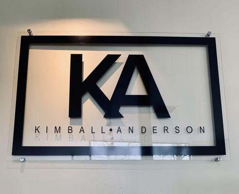 The Kimball Anderson logo featured at the top of the stairs on the way into the office.