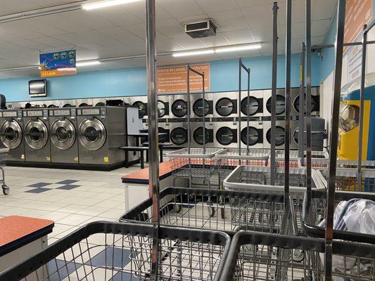 Tons of washers in the middle, dryers on the outside and carts available