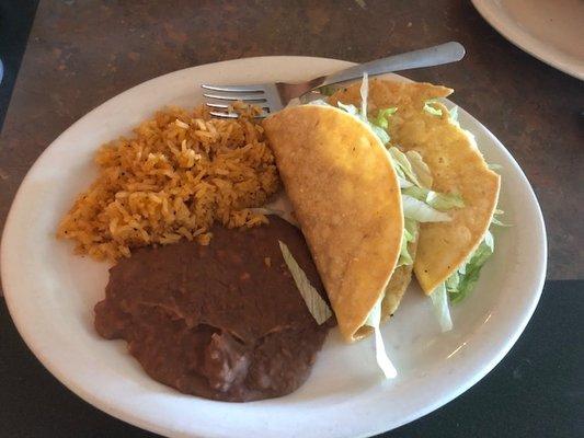 Awesome tacos, good rice, pass on the beans.