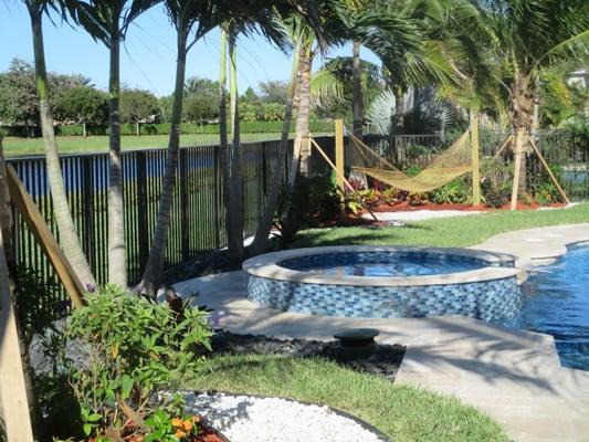 rockscape surrounding new swimming pool, new landscape for new swimming pool