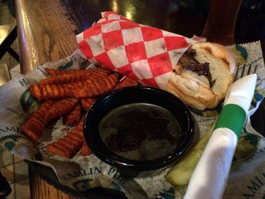 Prime Rib Philly Cheesesteak with sweet potato fries.