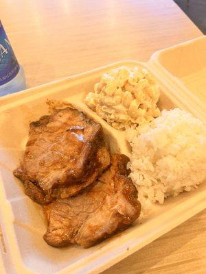 Braised brisket with sides of rice and Mac salad