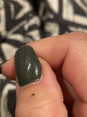 The thumb that was knowingly messed up that she just kept painting over rather than fixing it.