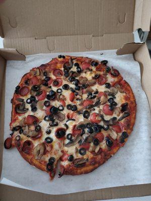 Small pizza with pepperoni mushrooms and black olives