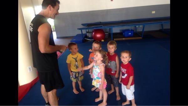 Coach Steve giving out stamps in the Daredevils and Divas Classes!