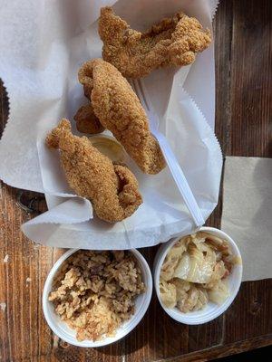 Fish, dirty rice and fried cabbage.