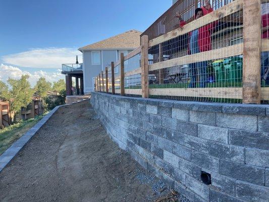 Retaining wall with split rail Fence