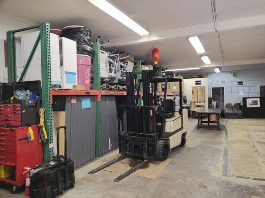 Forklift in warehouse.