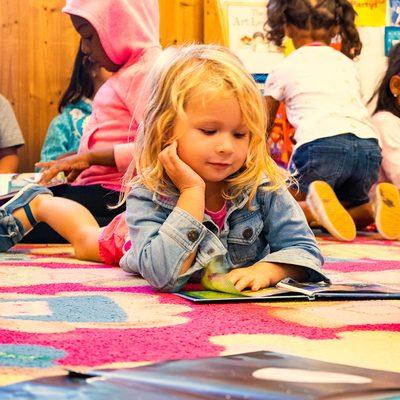 Classroom reading time!  No matter if they still cannot read, expose children to books is important