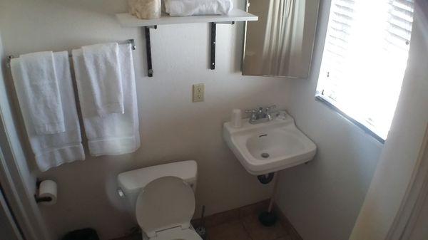 Bathroom, complete with the tiny soaps and plastic cups, and new towels of course.